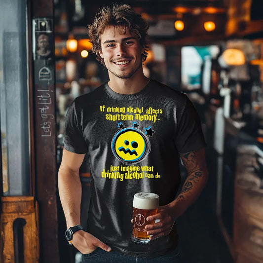 Man in bar hoding a beer and wearing black t-shirt with yellow graphic and text saying 'If drinking alcohol affects short term memory just imagine what drinking alcohol can do'