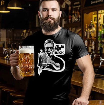 Man holding a beer in a bar wearing a black Terminator inspired t-shirt with the text 'Ale Be Back' 