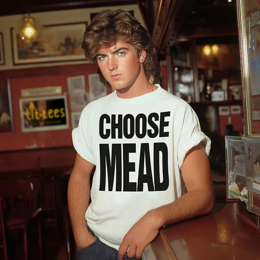 Wham lookalike wearing a 'Choose Mead' t-shirt in a bar setting