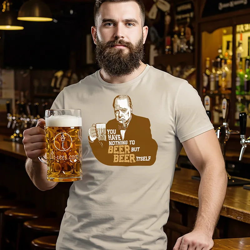 Man holding a beer mug in a bar wearing a t-shirt with the text 'You have nothing to beer but beer itself. 