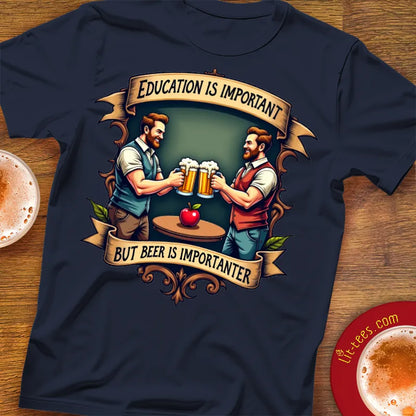 Navy blue t-shirt with graphic of two men holding beer mugs and text 'Education is important but beer is importanter' on a wooden surface.