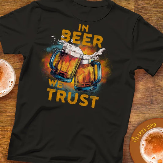 Black t-shirt with 'In Beer We Trust' graphic on a wooden bar table