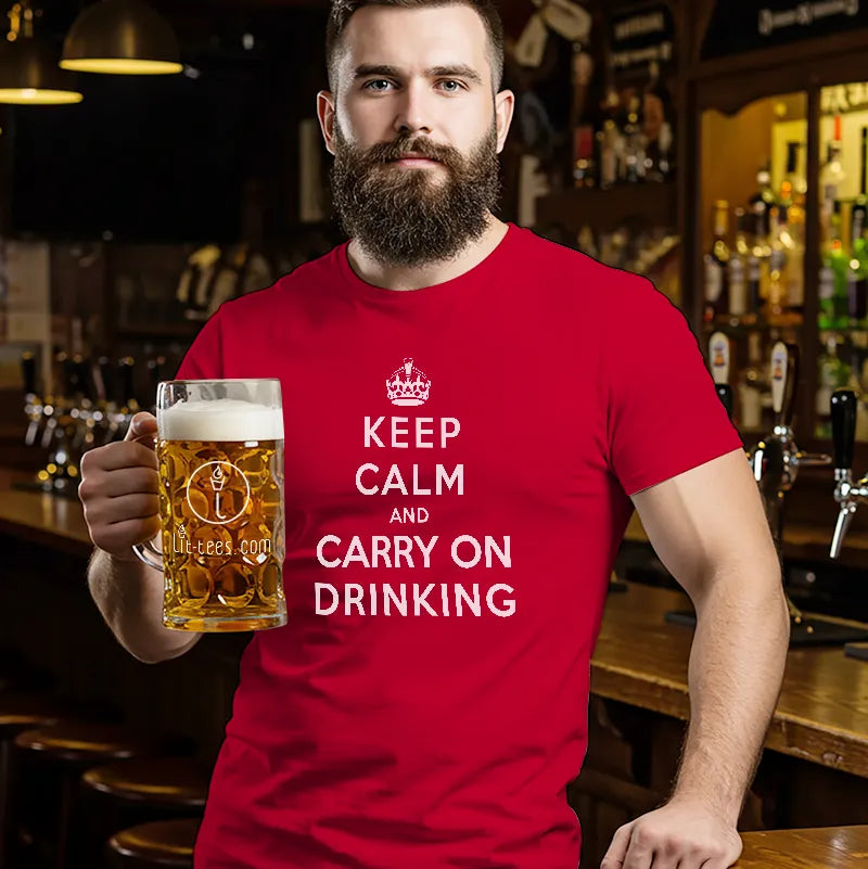 Man in bar holding a beer and wearing a red t shirt with text saying Keep Calm and Carry on Drinking
