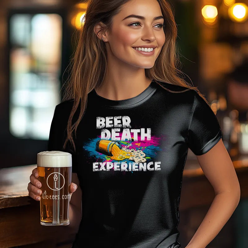 Woman wearing a black t-shirt with 'Beer Death Experience' design, holding a beer in a bar setting.