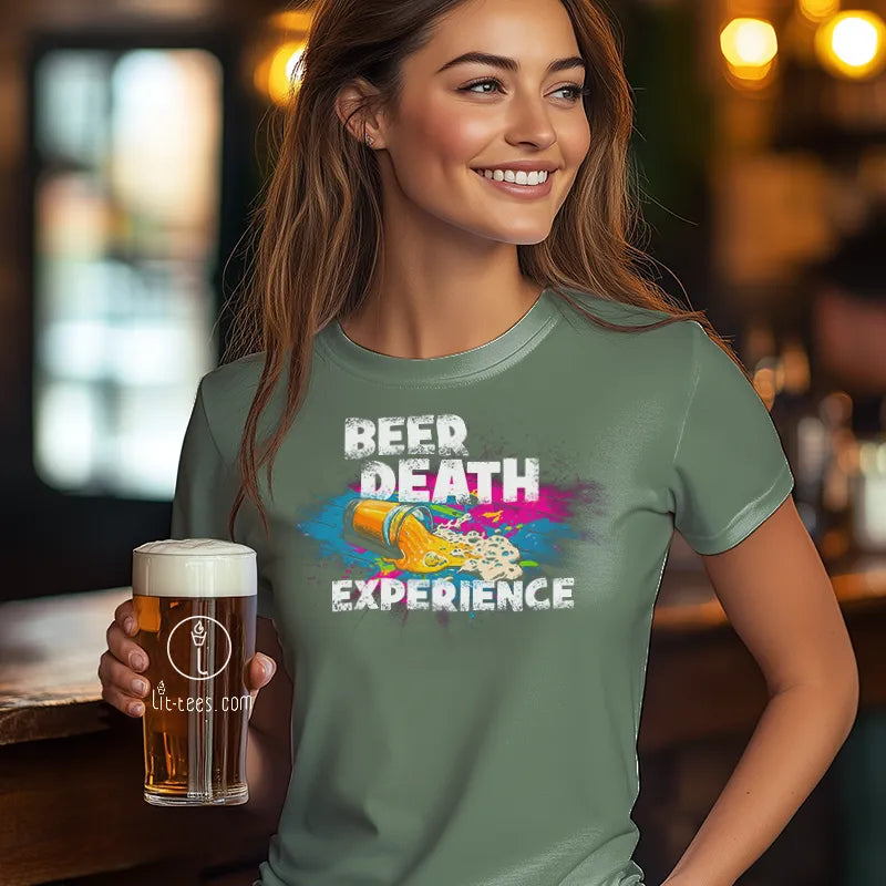 Woman wearing a t-shirt with 'Beer Death Experience' design, holding a beer in a bar setting.
