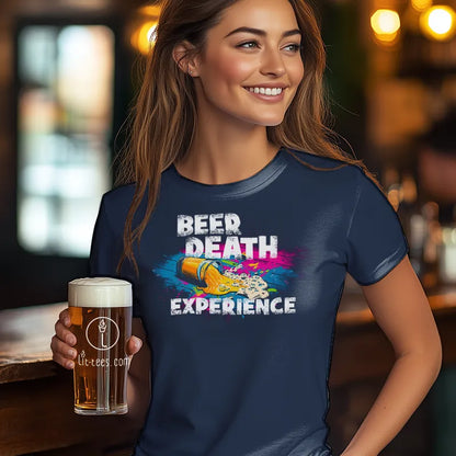 Woman wearing a blue t-shirt with 'Beer Death Experience' design, holding a beer in a bar setting.