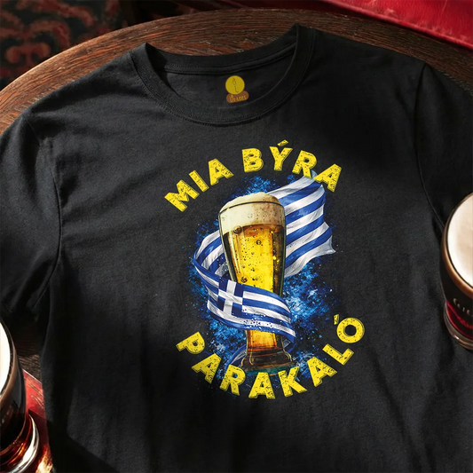 Black t-shirt with a graphic of a beer glass and Greek flag, text 'MIA BÝRA PARAKALÓ' on a wooden surface.