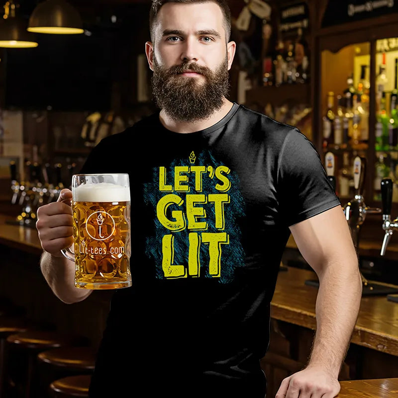 Man holding a beer mug in a bar wearing a black t-shirt with 'Let's Get Lit' text.