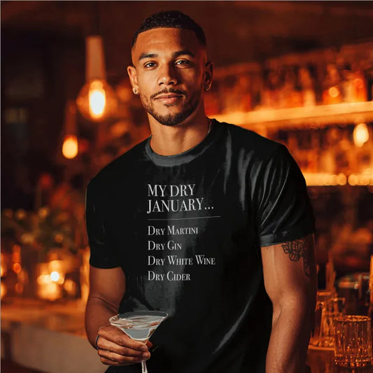 Man wearing a black t-shirt with 'My Dry January' text, holding a cocktail in a bar setting.