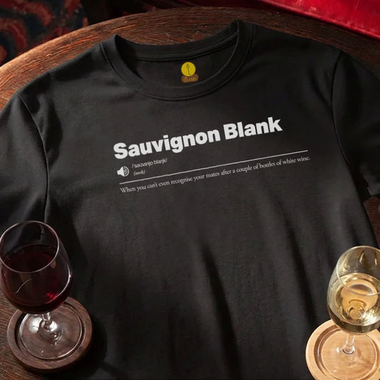 Black t-shirt with 'Sauvignon Blank' text, wine glasses on a wooden bar table.